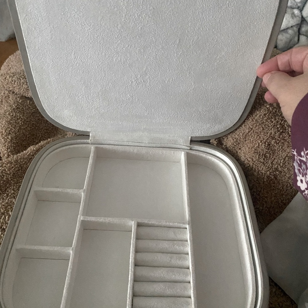 Pottery barn jewelry box, grey and has white velvet inside